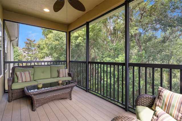 sunroom with ceiling fan and plenty of natural light