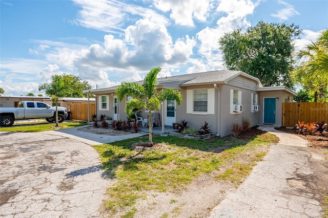 single story home featuring cooling unit