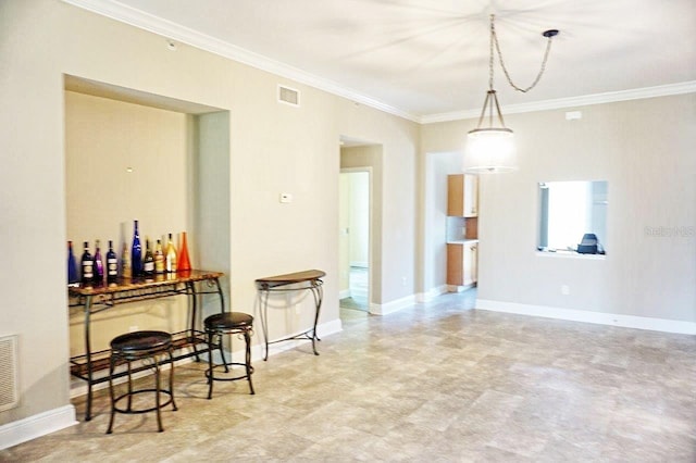 tiled dining area featuring ornamental molding