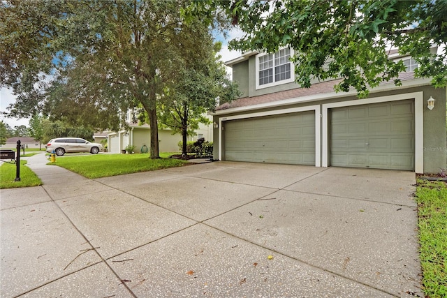 garage featuring a lawn