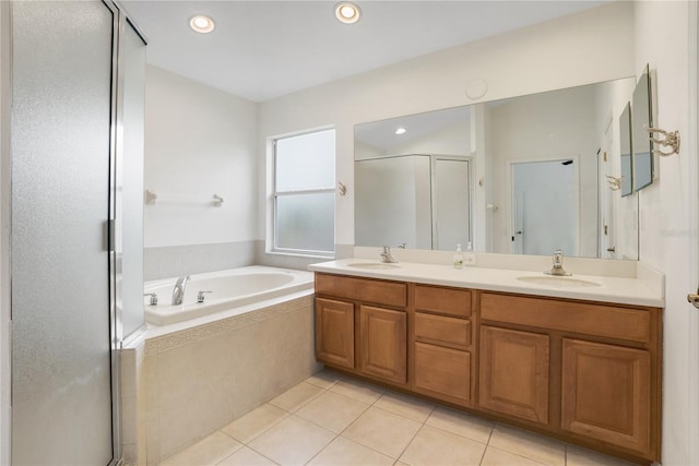 bathroom featuring tile patterned flooring, vanity, and independent shower and bath