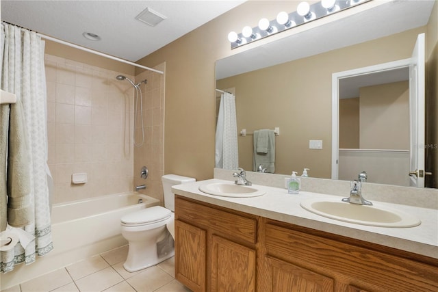 full bathroom featuring tile patterned flooring, vanity, toilet, and shower / tub combo