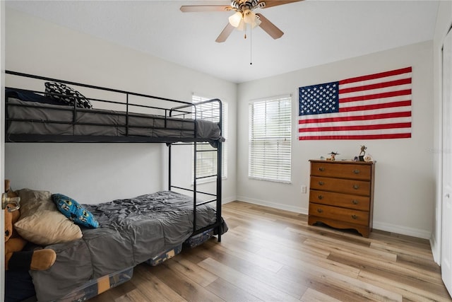 bedroom featuring hardwood / wood-style floors and ceiling fan