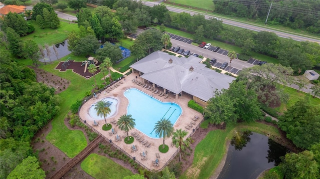 birds eye view of property with a water view