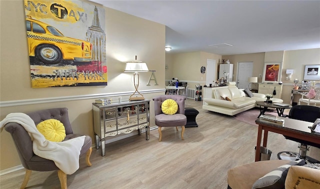 living room with baseboards and wood finished floors