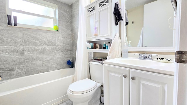 full bath with  shower combination, vanity, and toilet