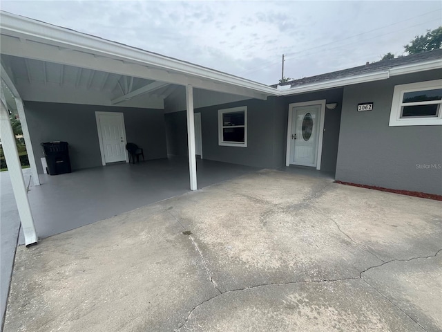 exterior space featuring a carport