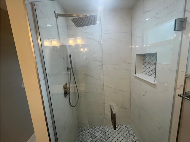 bathroom featuring a shower with door