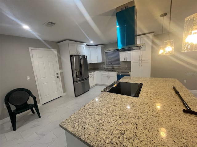 kitchen featuring white cabinetry, sink, stainless steel appliances, range hood, and pendant lighting