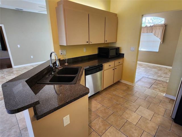 kitchen with sink, kitchen peninsula, stainless steel dishwasher, and light tile patterned flooring