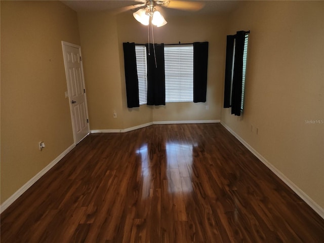 unfurnished room featuring ceiling fan and dark hardwood / wood-style flooring