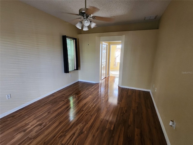 spare room featuring ceiling fan, hardwood / wood-style flooring, a textured ceiling, and lofted ceiling