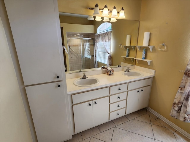 bathroom with tile patterned flooring and dual vanity