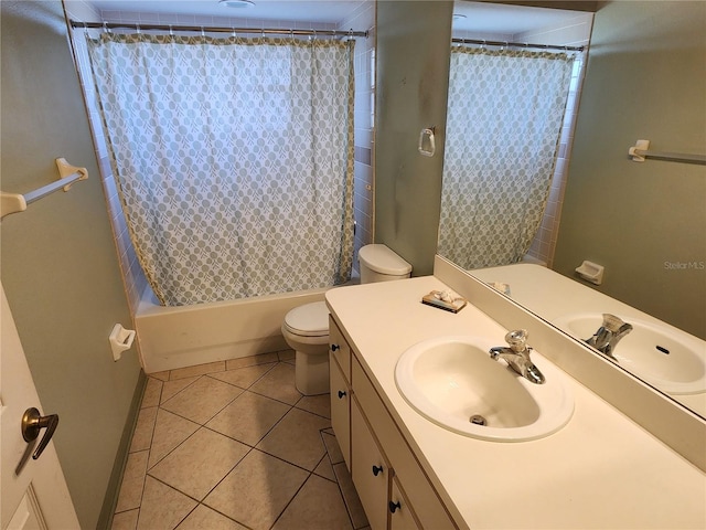 full bathroom featuring toilet, tile patterned floors, shower / bath combination with curtain, and vanity