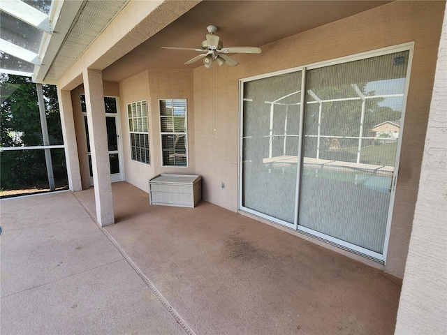 view of patio featuring ceiling fan