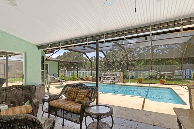 view of pool featuring a patio, a lanai, and pool water feature