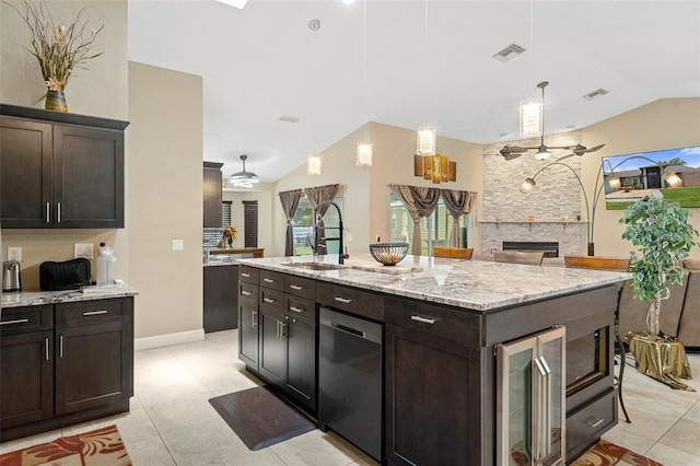 6096 Kinlock Ave, Spring Hill, FL 34608 - kitchen featuring visible vents, a sink, vaulted ceiling, and a stone fireplace