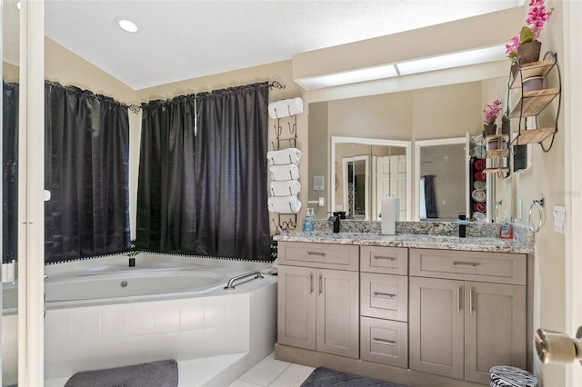 6096 Kinlock Ave, Spring Hill, FL 34608 - bathroom featuring a garden tub, double vanity, tile patterned floors, and recessed lighting