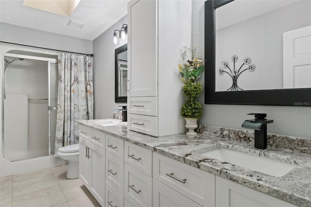 6096 Kinlock Ave, Spring Hill, FL 34608 - full bathroom with double vanity, toilet, a sink, and a stall shower