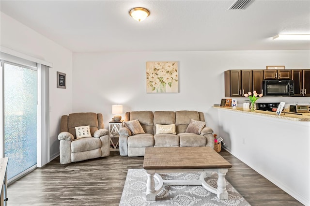 living room with dark wood-type flooring