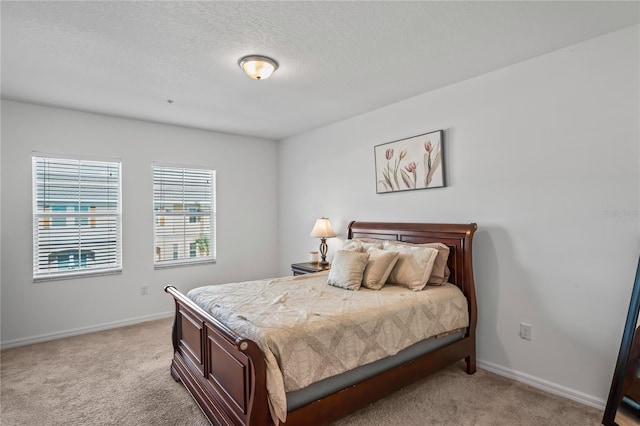 carpeted bedroom with a textured ceiling