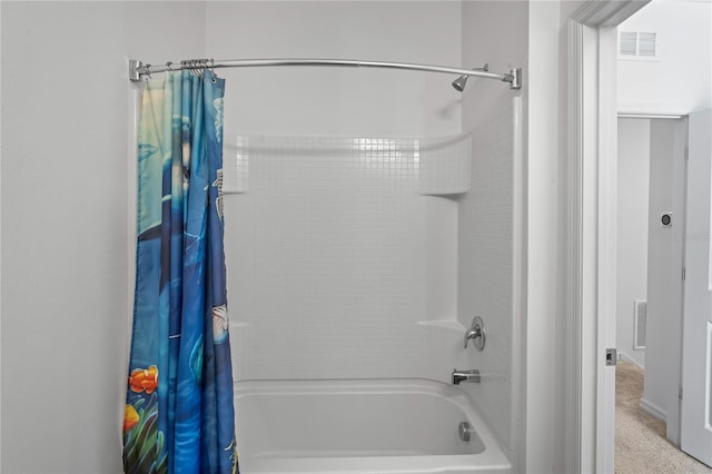 bathroom with shower / bathtub combination with curtain