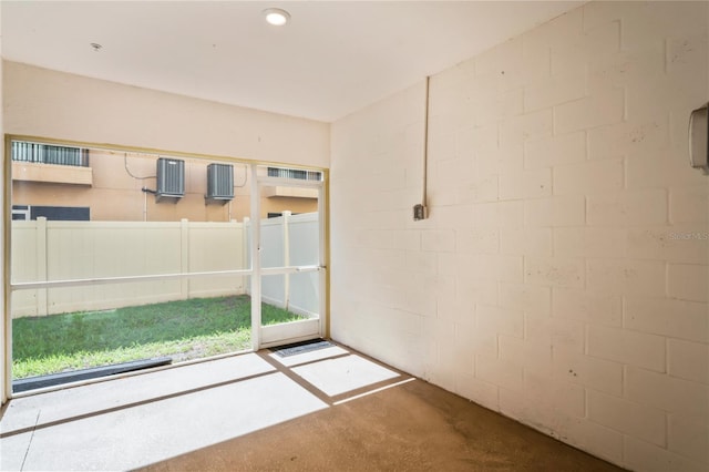 empty room with concrete flooring