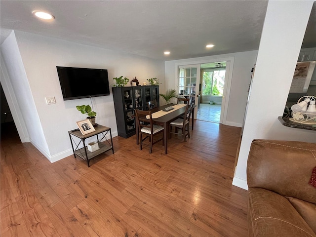 dining space featuring wood-type flooring