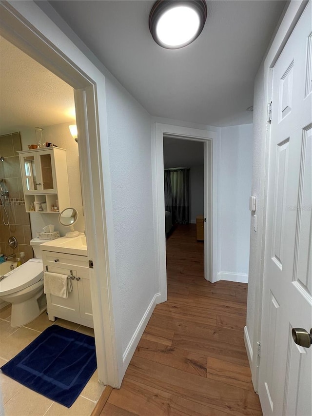 hallway with light wood-type flooring