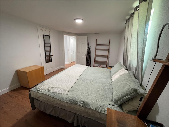 bedroom with hardwood / wood-style floors