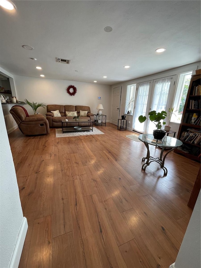 unfurnished living room with light hardwood / wood-style floors