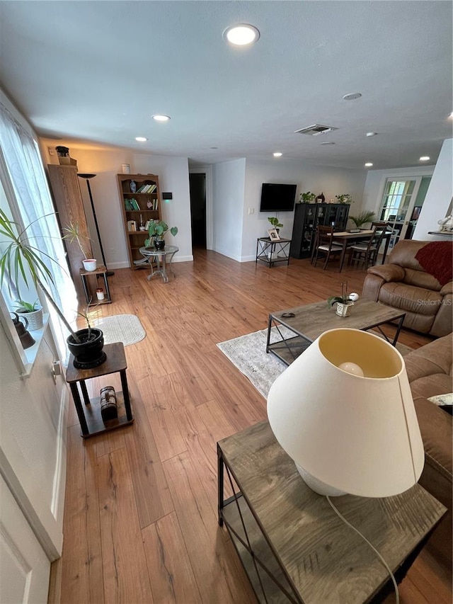 living room with light hardwood / wood-style flooring