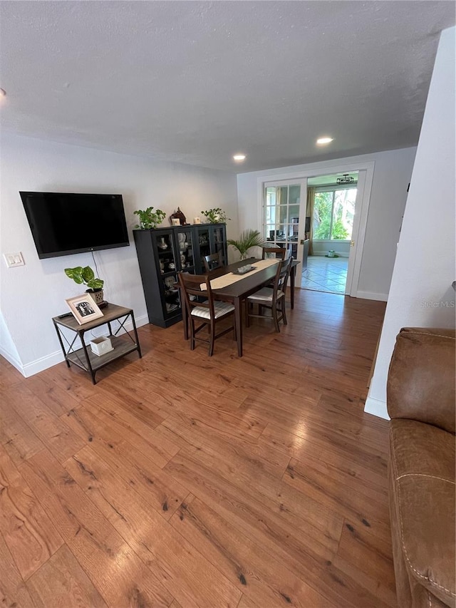 dining room with hardwood / wood-style floors