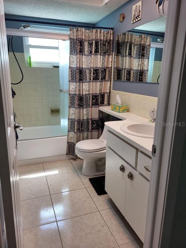 full bathroom with shower / bath combo, backsplash, vanity, a textured ceiling, and toilet