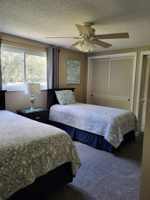 bedroom with ceiling fan and a textured ceiling