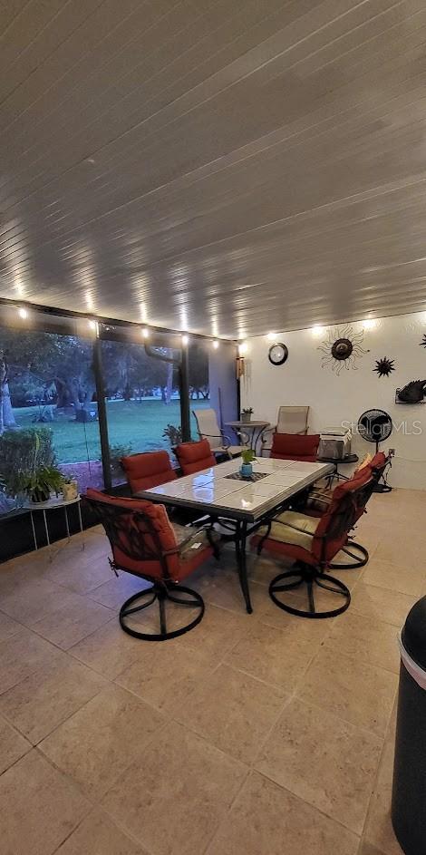 dining area with tile patterned floors and billiards