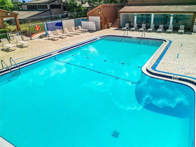 view of swimming pool with a patio