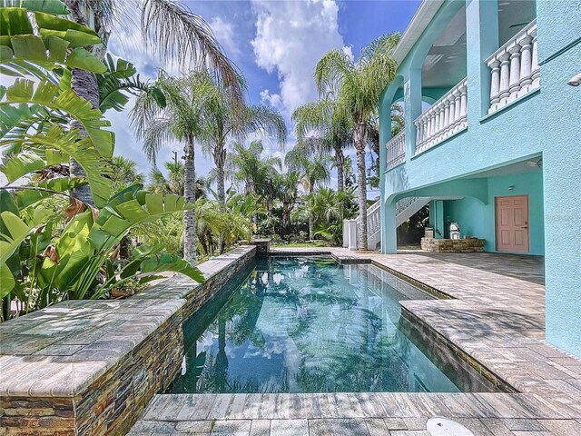 view of pool featuring a patio