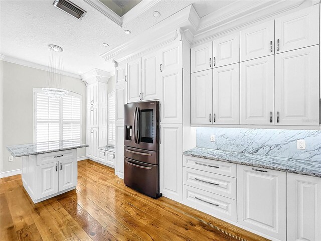 kitchen featuring white cabinetry, light hardwood / wood-style flooring, crown molding, and stainless steel fridge with ice dispenser