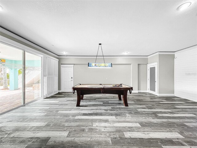 recreation room featuring crown molding, billiards, wood-type flooring, and a textured ceiling