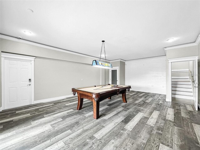 playroom featuring pool table, ornamental molding, and dark hardwood / wood-style floors