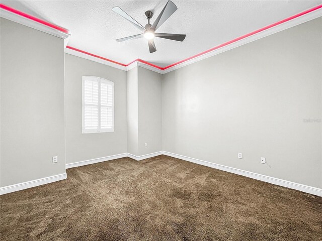 carpeted spare room with ornamental molding, ceiling fan, and a textured ceiling