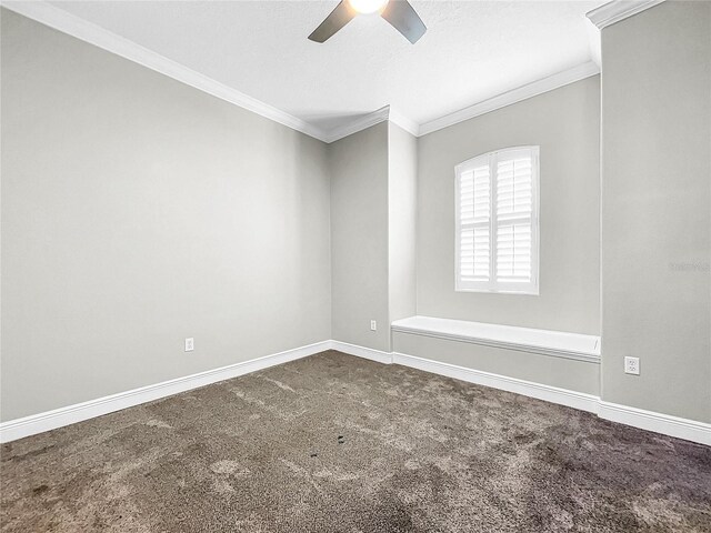 carpeted empty room featuring crown molding and ceiling fan