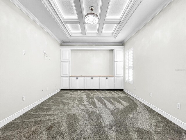 spare room with coffered ceiling, crown molding, and carpet flooring