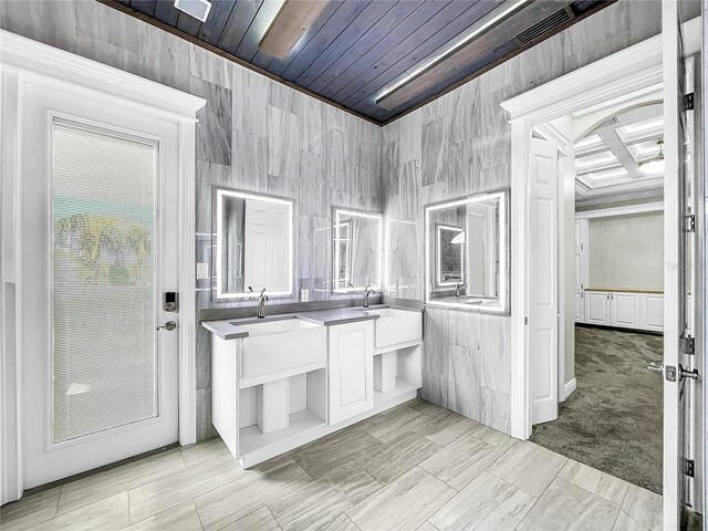 bathroom featuring vanity, wood ceiling, coffered ceiling, and tile walls