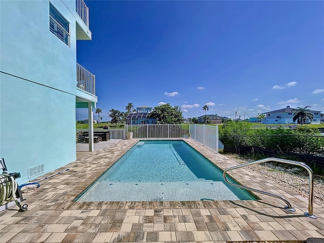 view of swimming pool with a patio area