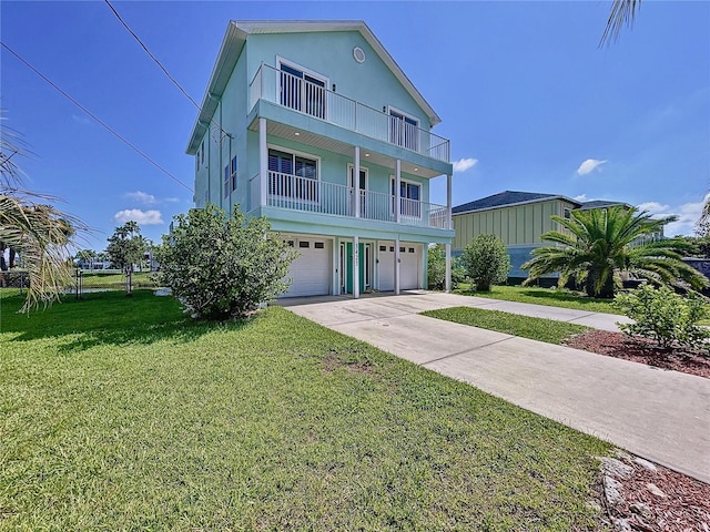 view of front facade featuring a balcony, a garage, and a front lawn