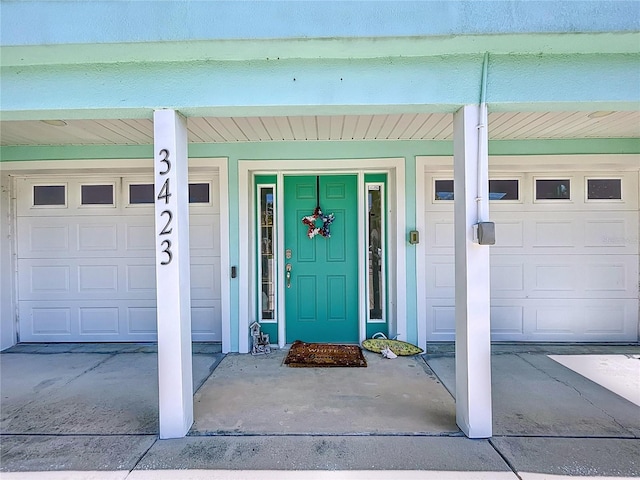 entrance to property featuring a garage