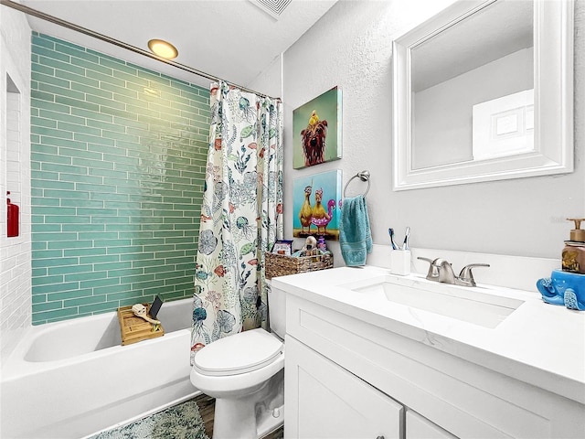 full bathroom featuring vanity, shower / tub combo, a textured ceiling, and toilet