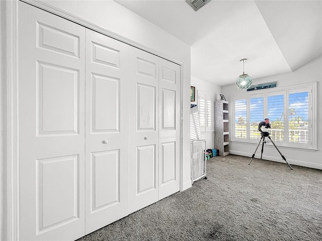 unfurnished bedroom featuring carpet floors and a closet